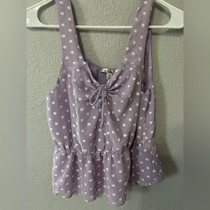 Lavender tank top with white embroidered flowers. Size XS, but can fit a S.